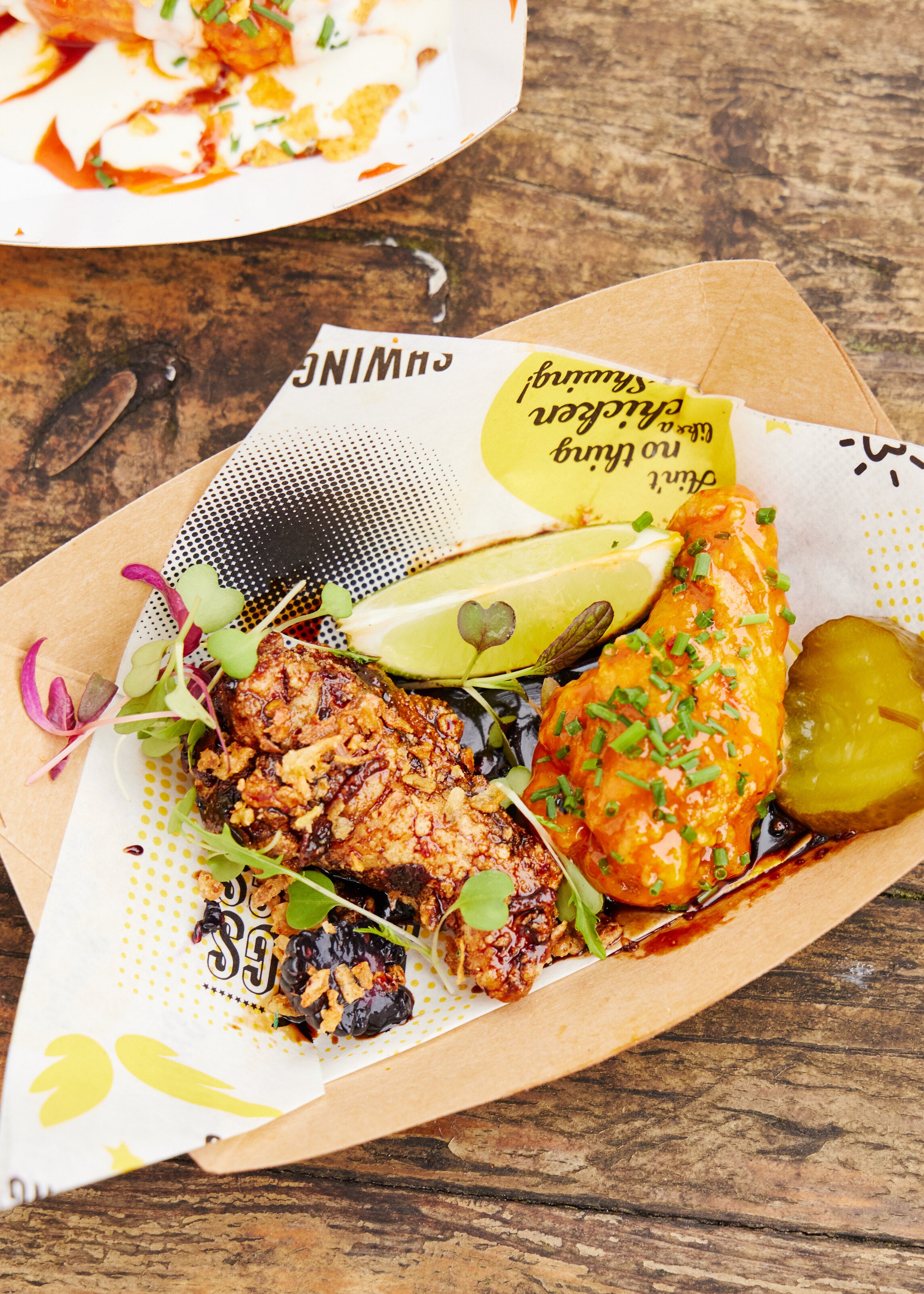 award winning wings from Shwings at wingjam London's best wings event, WingJam London Where Friends Feast on the Best Chicken Wings, WingJam London A Fun and Flavor-Packed Festival, WingJam London People Relishing Every Wing Bite Together, WingJam London A Celebration of Delicious Wings and Friendship