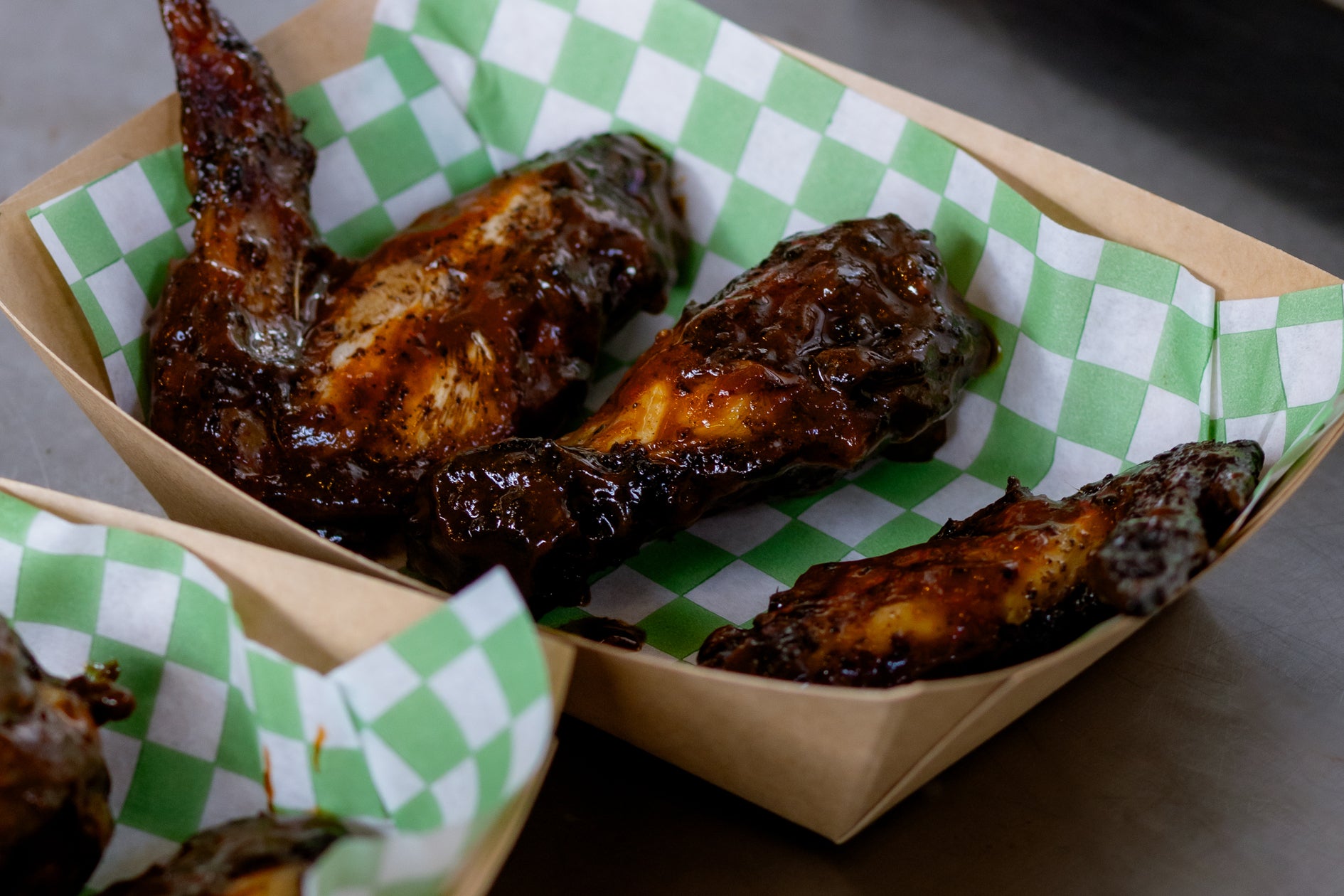 smoked chicken wings from Ruben's Reubens at wingjam 2024, WingJam London A Festival for Friends Who Love Food, WingJam London The Ultimate Chicken Wing Experience with Friends, WingJam London People Gathering for the Best Wings, WingJam London A Fun Food Event for Friends and Family, WingJam London People Loving Every Bite of Chicken Wings